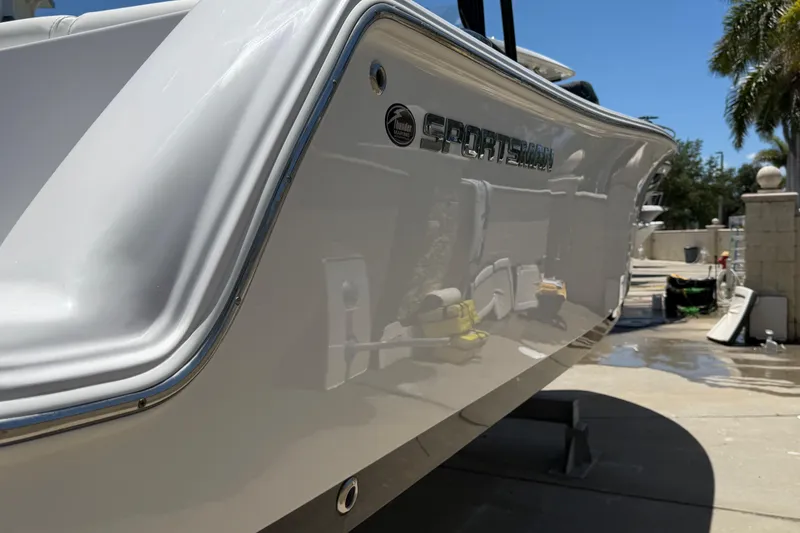 Slide: The Image of 2022 Sportsman Heritage 231 Center Console boat, sleek design, outdoor setting. - 5