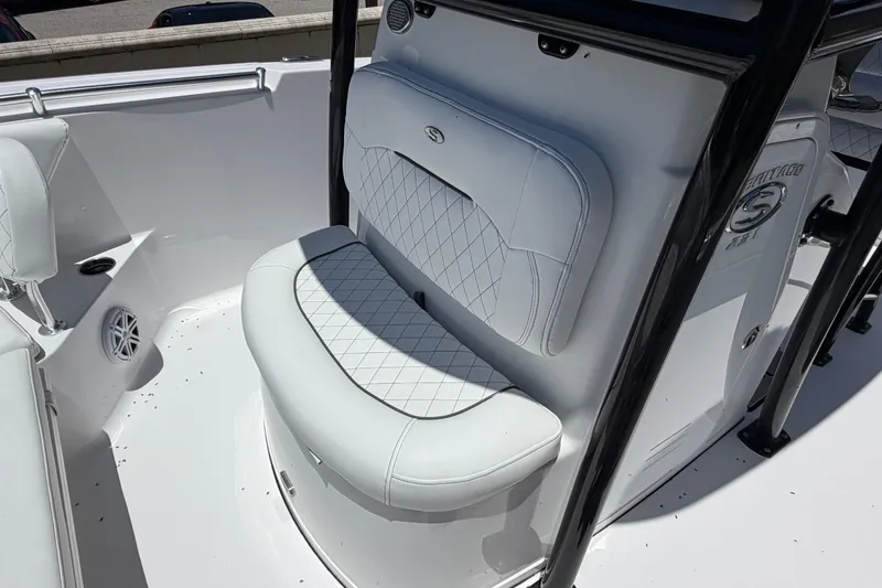 Slide: The Image of 2022 Sportsman Heritage 231 Center Console boat with cushioned seating and sleek design. - 9