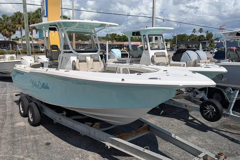 The Image of 2025 Key West 260 Center Console boat on trailer, displayed outdoors. - 0