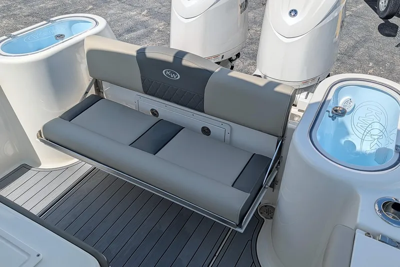 Slide: The Image of 2025 Key West 260 Center Console boat with cushioned seating and dual livewells. - 10