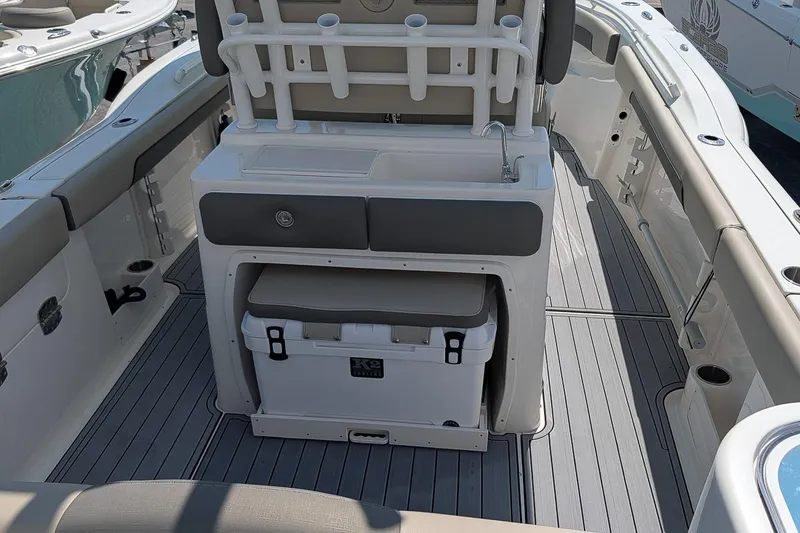 Slide: The Image of 2025 Key West 260 Center Console boat interior with seating and storage. - 11