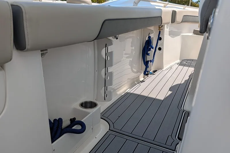 Slide: The Image of 2025 Key West 260 Center Console boat interior with sleek seating and storage features. - 12