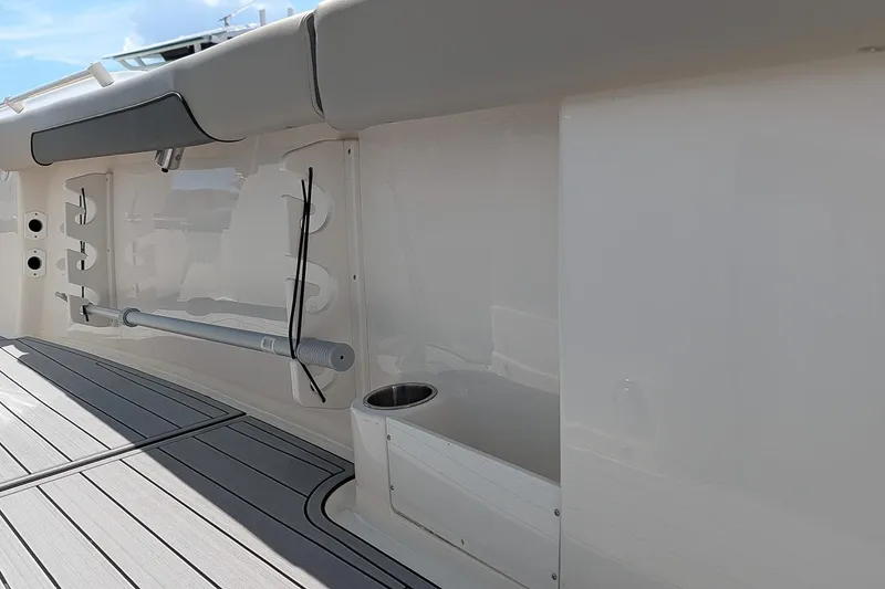 Slide: The Image of 2025 Key West 260 Center Console boat interior with rod holders and cup holder. - 13