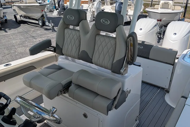 Slide: The Image of 2025 Key West 260 Center Console boat with luxurious seating and modern design. - 14