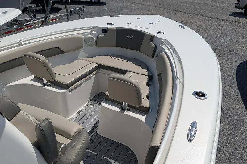 Slide: The Image of 2025 Key West 260 Center Console boat interior with cushioned seating and sleek design. - 19