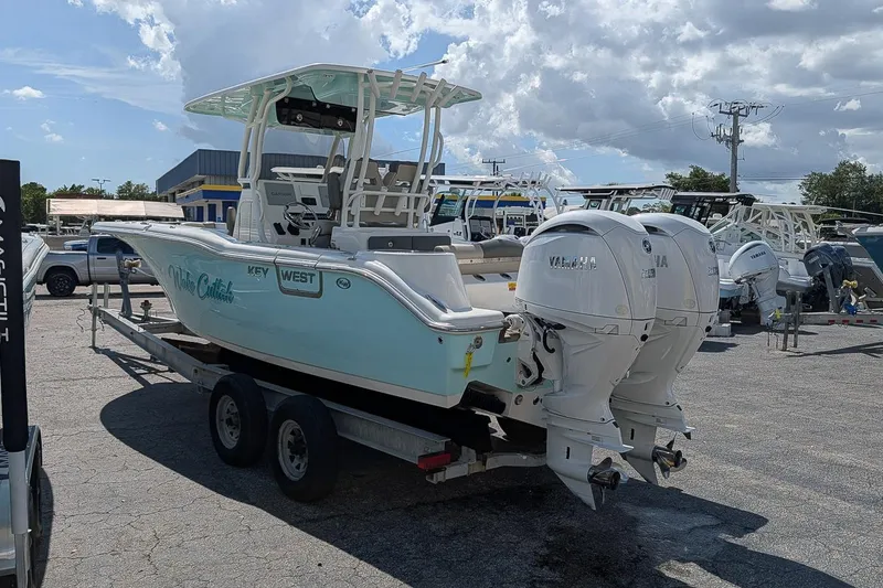 Slide: The Image of 2025 Key West 260 Center Console boat with twin Yamaha engines on a trailer. - 3