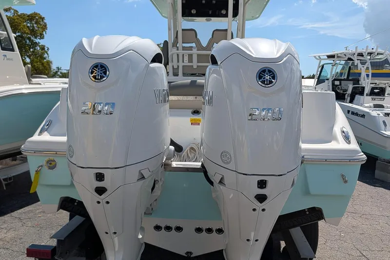 Slide: The Image of Twin Yamaha 200 engines on a 2025 Key West 260 Center Console boat. - 6