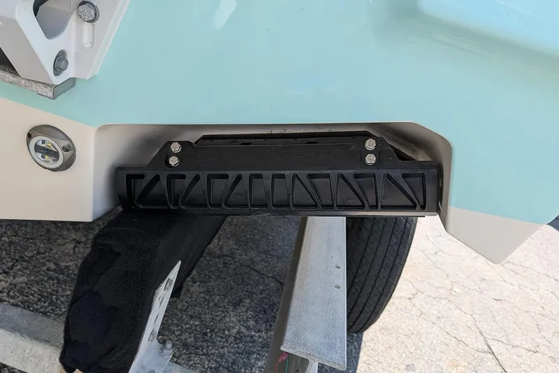 Slide: The Image of 2025 Key West 260 Center Console boat on trailer, close-up of hull and mounting hardware. - 7
