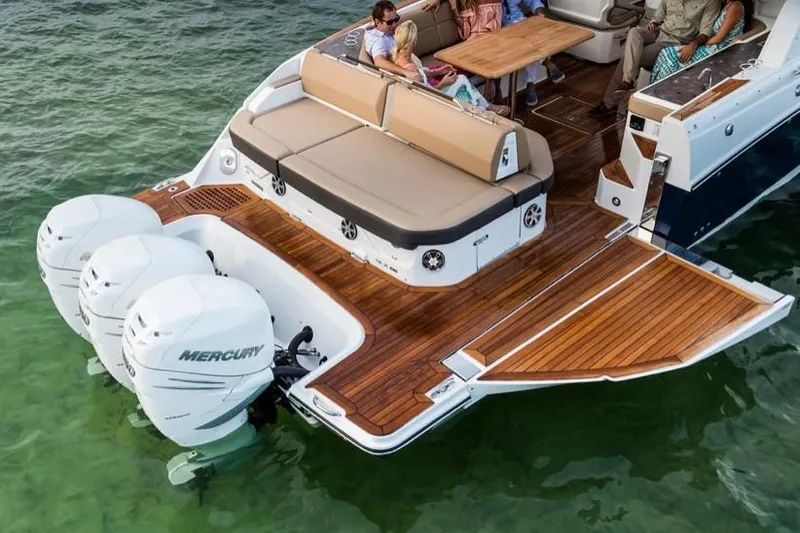 Slide: The Image of Manufacturer Provided Image: 2019 Sea Ray SLX 400 OB with triple Mercury outboard engines on the water. - 13
