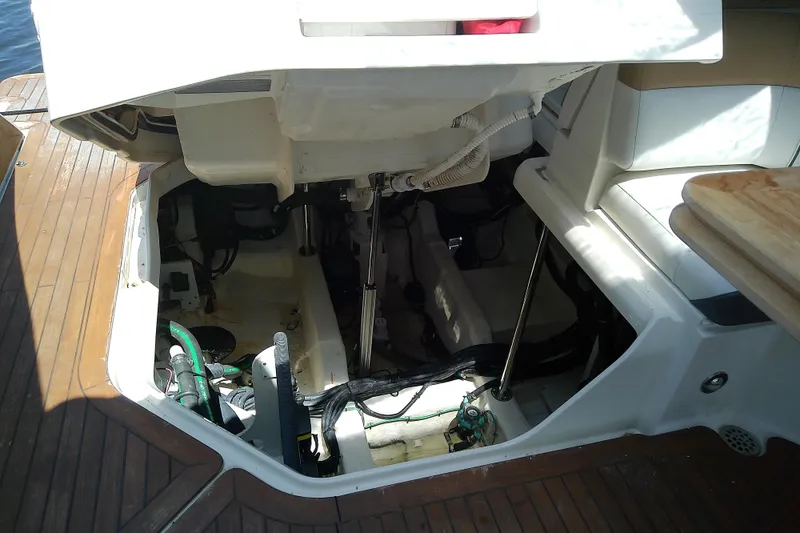 Slide: The Image of Open engine compartment of 2019 Sea Ray SLX 400 Outboard boat, showcasing interior components. - 53