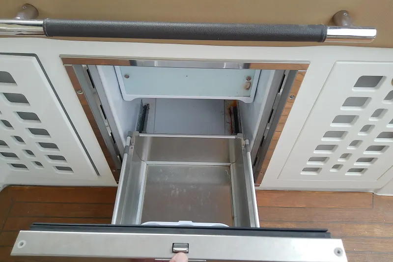 Slide: The Image of Open drawer on 2019 Sea Ray SLX 400 Outboard boat, showcasing storage compartment. - 22