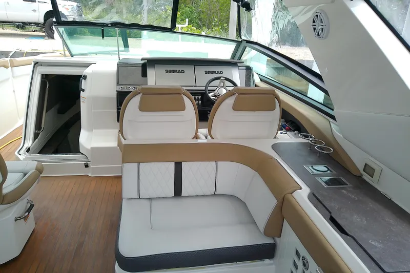 Slide: The Image of Interior of 2019 Sea Ray SLX 400 Outboard with luxurious seating and modern dashboard. - 24