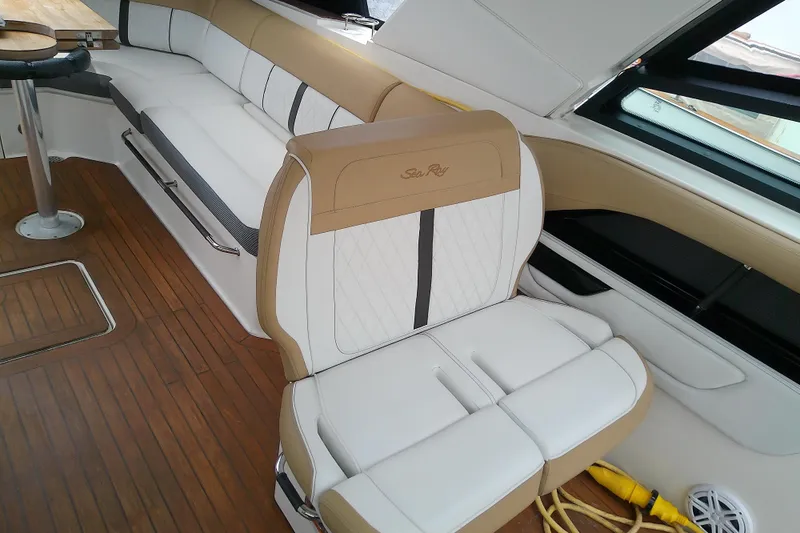 Slide: The Image of Luxurious interior of 2019 Sea Ray SLX 400 Outboard with elegant seating and wood flooring. - 25