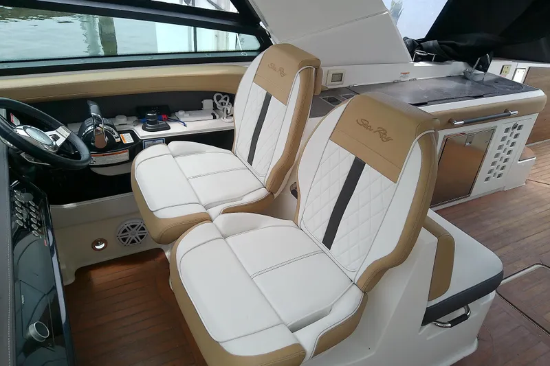 Slide: The Image of 2019 Sea Ray SLX 400 Outboard cockpit with luxurious seating and modern controls. - 26