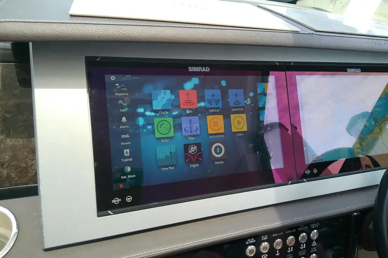 Slide: The Image of Simrad navigation display on 2019 Sea Ray SLX 400 Outboard boat dashboard. - 32