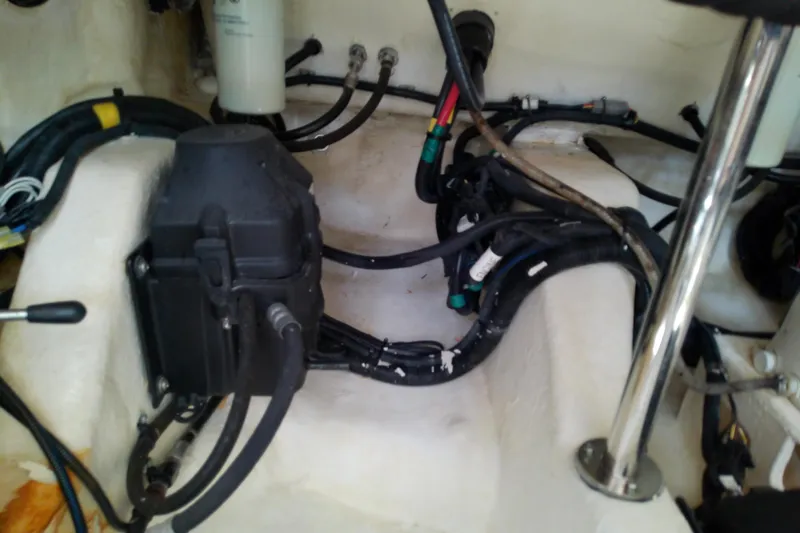 Slide: The Image of Engine compartment of a 2019 Sea Ray SLX 400 Outboard with visible wiring and components. - 61