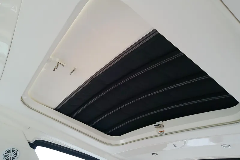 Slide: The Image of 2019 Sea Ray SLX 400 Outboard sunroof interior view. - 35