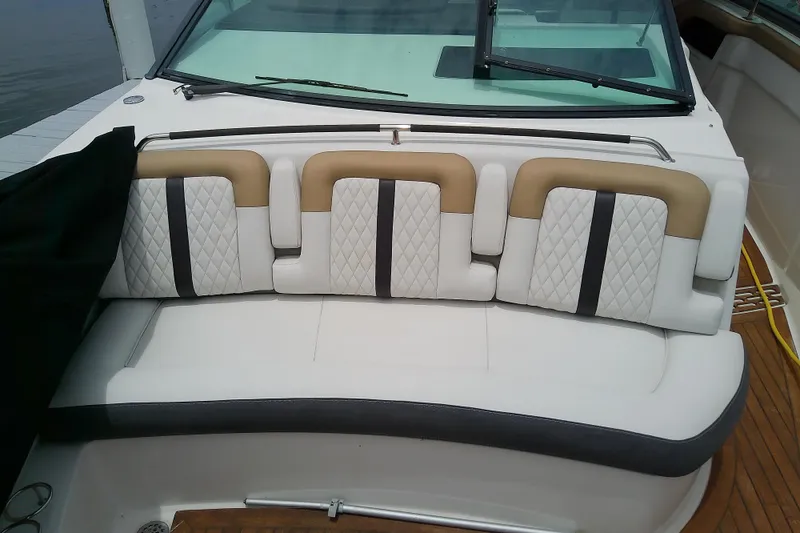 Slide: The Image of 2019 Sea Ray SLX 400 Outboard boat with luxurious white and tan seating. - 38