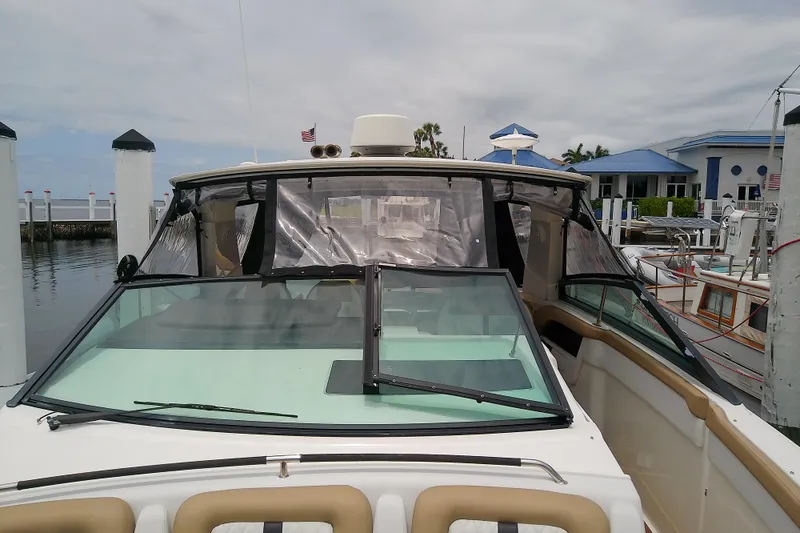 Slide: The Image of 2019 Sea Ray SLX 400 Outboard docked at marina, front view. - 39