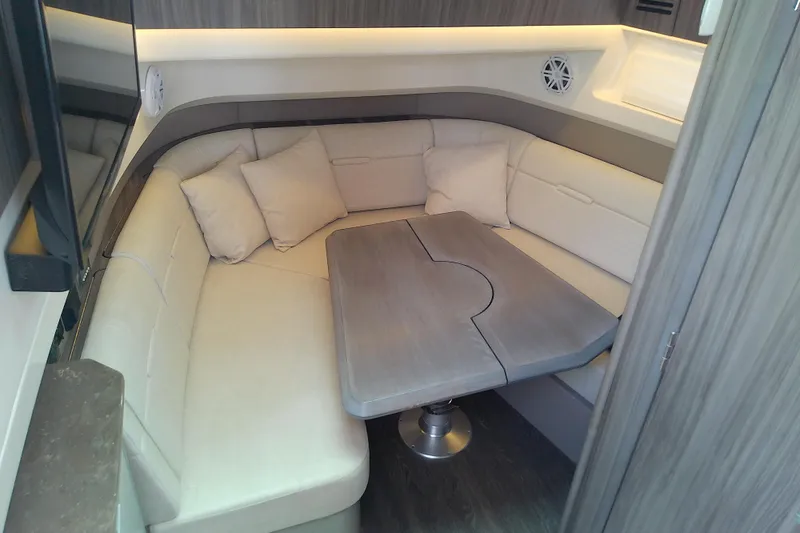 Slide: The Image of Luxurious interior of 2019 Sea Ray SLX 400 Outboard with plush seating and table. - 41