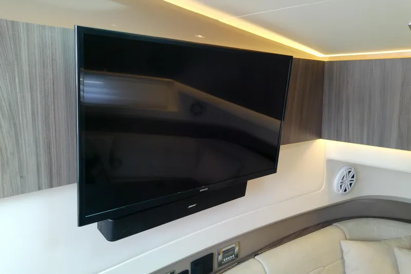 Slide: The Image of Flat-screen TV in 2019 Sea Ray SLX 400 Outboard cabin with modern interior design. - 42