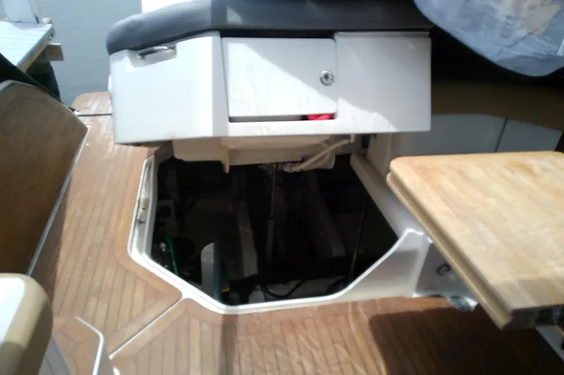 Slide: The Image of 2019 Sea Ray SLX 400 Outboard interior with wooden flooring and storage compartment. - 51