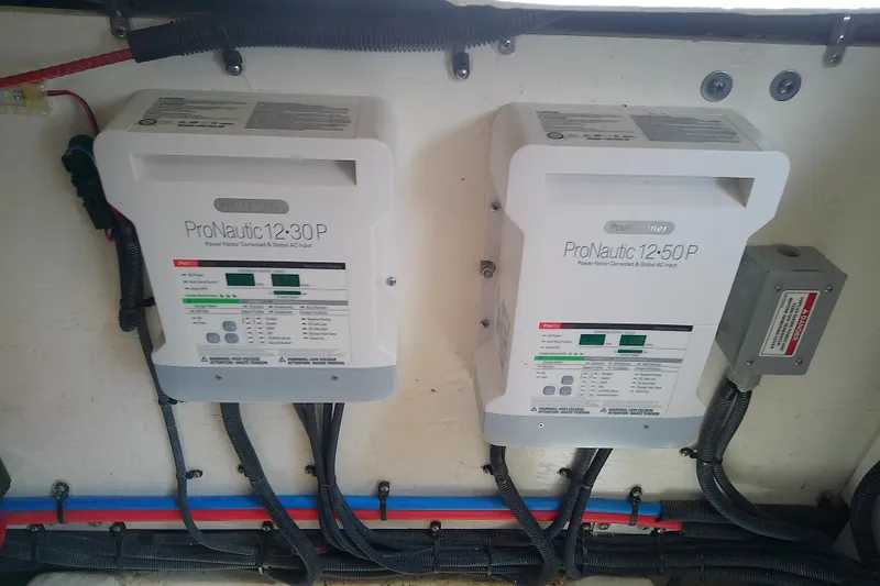 Slide: The Image of ProNautic chargers installed in a 2019 Sea Ray SLX 400 Outboard boat's electrical system. - 53