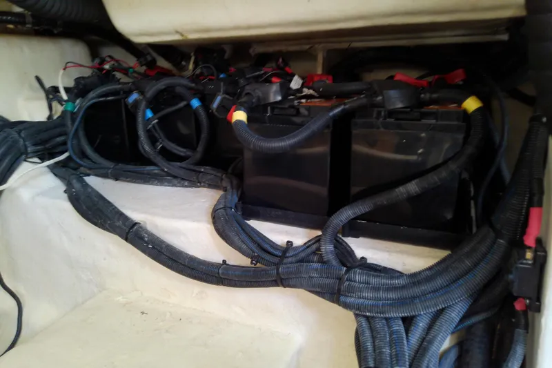 Slide: The Image of Battery compartment of a 2019 Sea Ray SLX 400 Outboard with organized wiring. - 55
