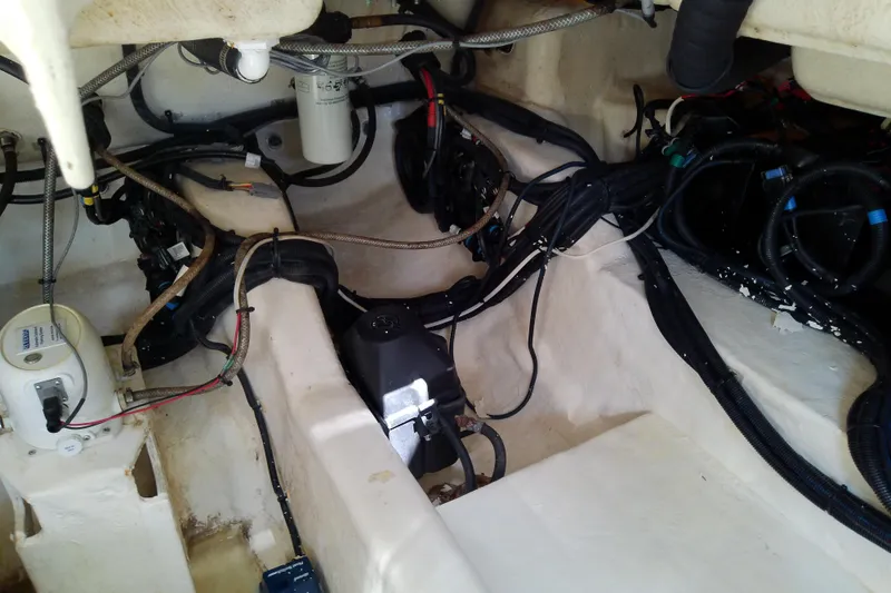 Slide: The Image of Engine compartment of a 2019 Sea Ray SLX 400 Outboard, showcasing wiring and components. - 60