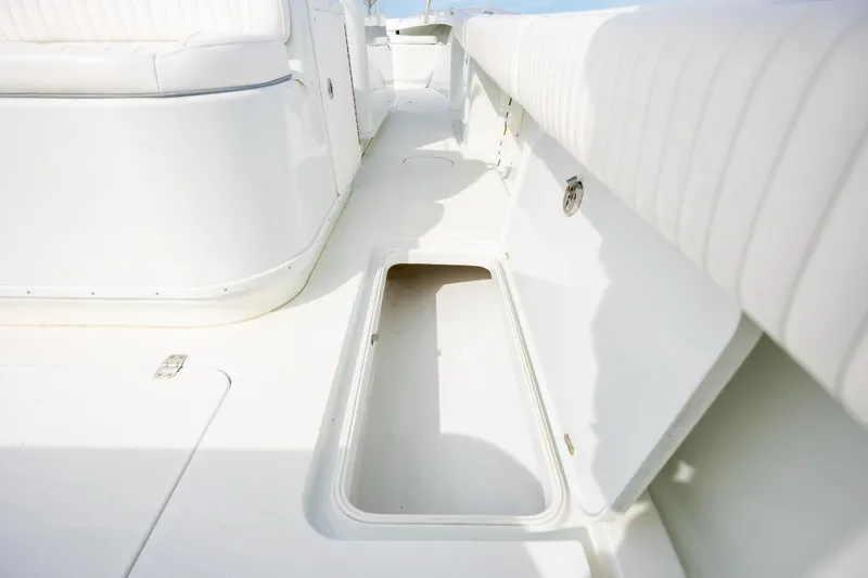 Slide: The Image of 2013 Yellowfin 32 Offshore boat interior with open storage compartment. - 24