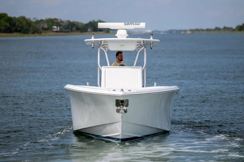 Slide: The Image of 2013 Yellowfin 32 Offshore boat cruising on calm water. - 9