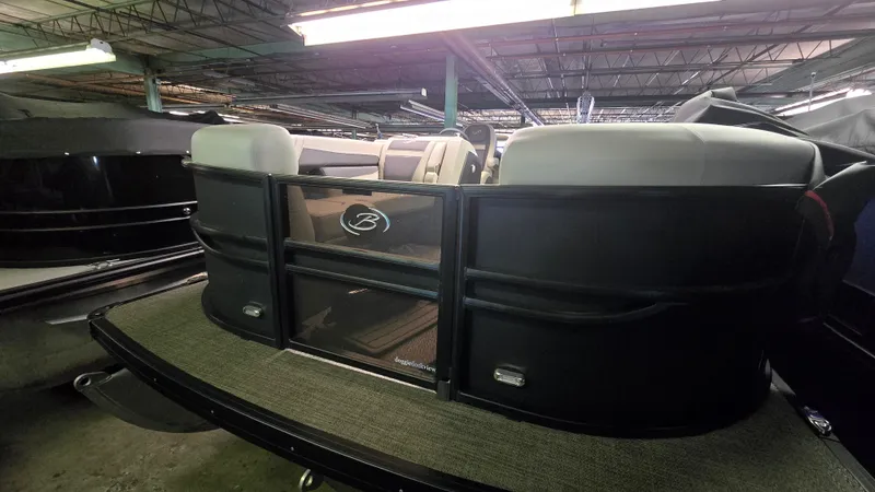 Slide: The Image of 2024 Barletta Cabrio 22 UC pontoon boat in storage. - 1
