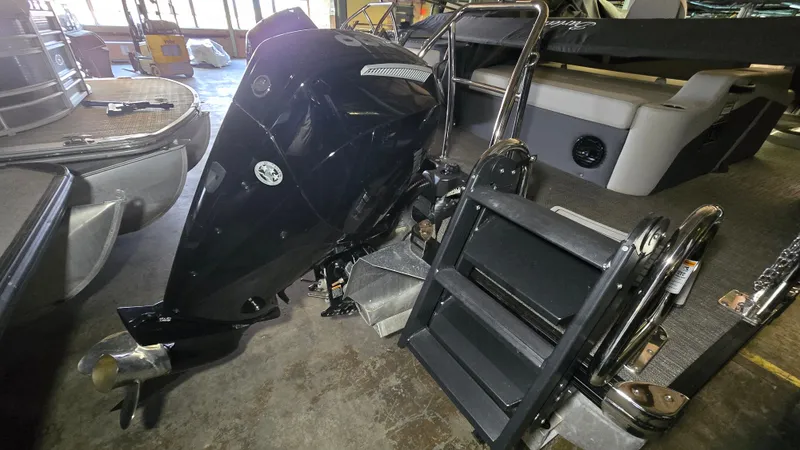 Slide: The Image of 2024 Barletta CABRIO 22 UC boat with outboard motor and ladder. - 13
