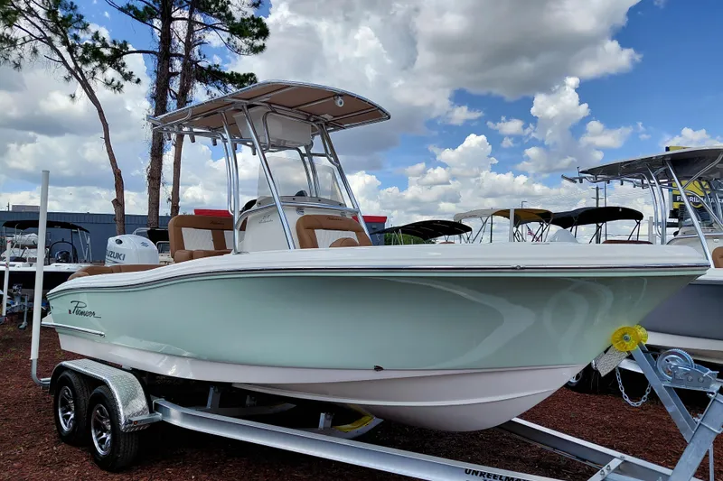 The Image of 2026 Pioneer 202 Islander boat on trailer under cloudy sky. - 1