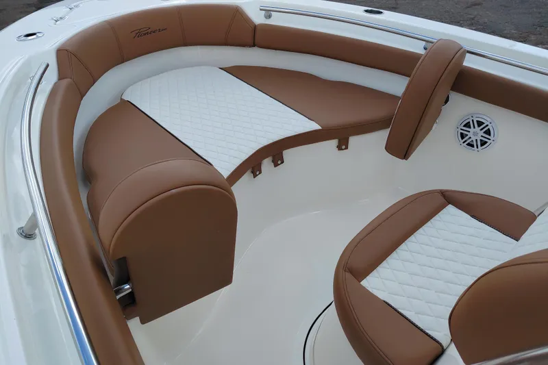 Slide: The Image of Luxurious seating in 2026 Pioneer 202 Islander boat with brown and white upholstery. - 20