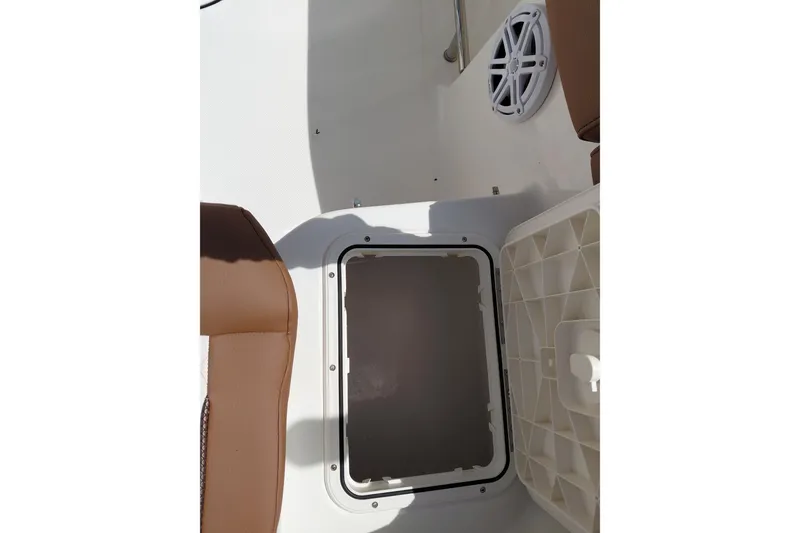 Slide: The Image of 2026 Pioneer 202 Islander boat interior with storage compartment and speaker. - 36