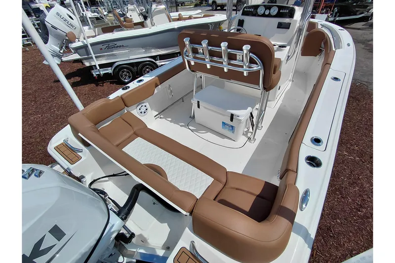 Slide: The Image of 2026 Pioneer 202 Islander boat interior with tan seating and modern console design. - 37
