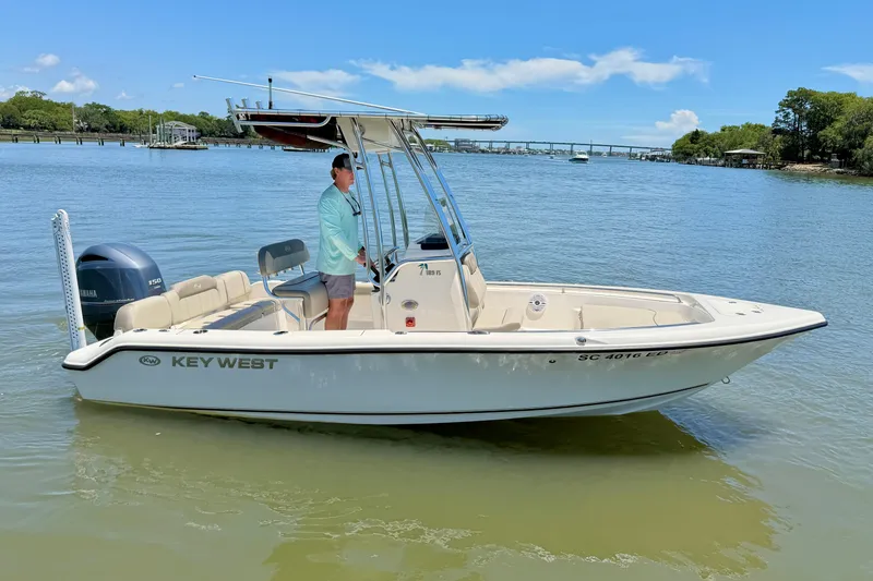 The Image of 2023 Key West 189 FS boat on calm water, featuring a sleek design and Yamaha engine. - 0