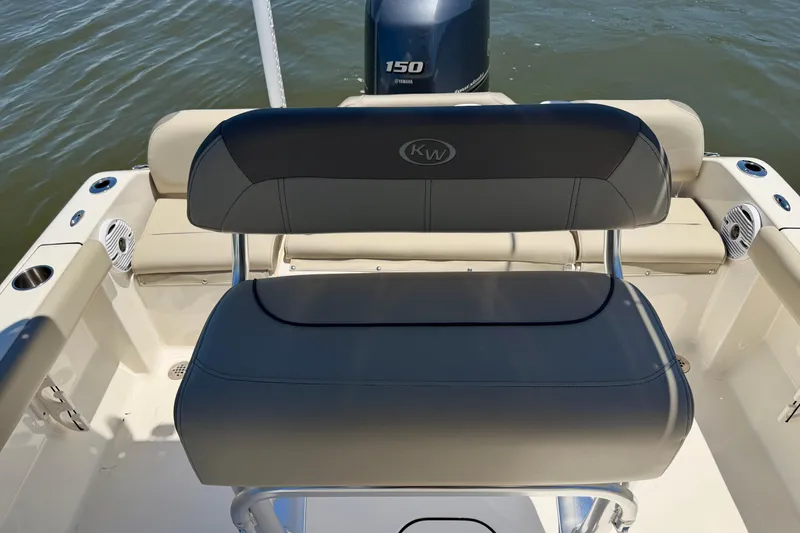 Slide: The Image of 2023 Key West 189 FS boat seating with Yamaha 150 engine on water. - 15
