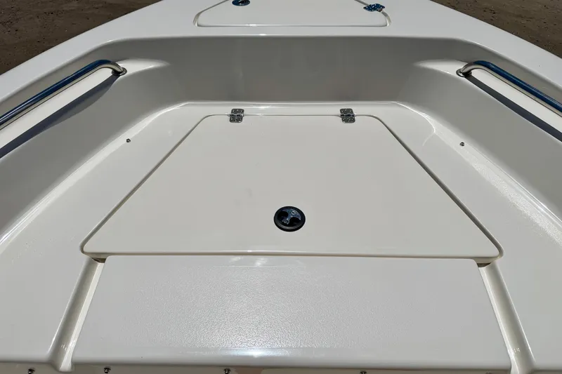 Slide: The Image of 2023 Key West 189 FS boat deck with storage compartment and stainless steel rails. - 17