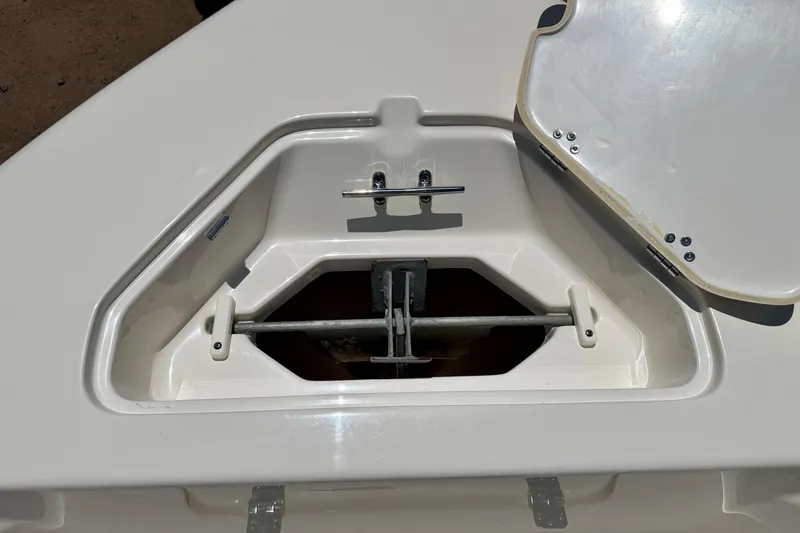 Slide: The Image of Open anchor compartment on 2023 Key West 189 FS boat, showcasing storage space. - 21