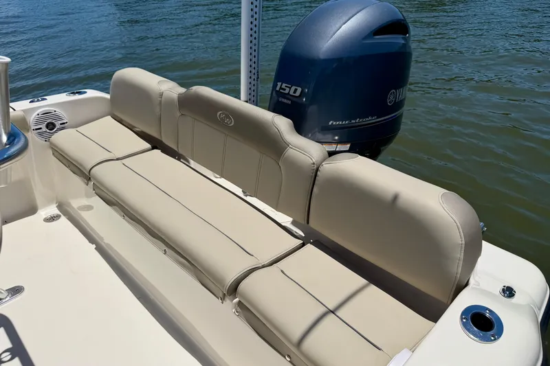 Slide: The Image of 2023 Key West 189 FS boat with Yamaha 150 engine, featuring beige seating. - 23