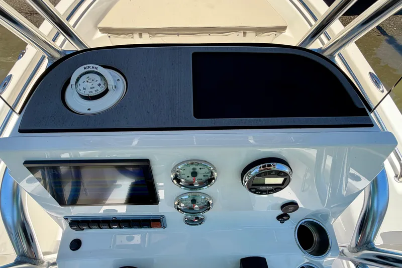 Slide: The Image of 2023 Key West 189 FS boat dashboard with compass and gauges. - 31
