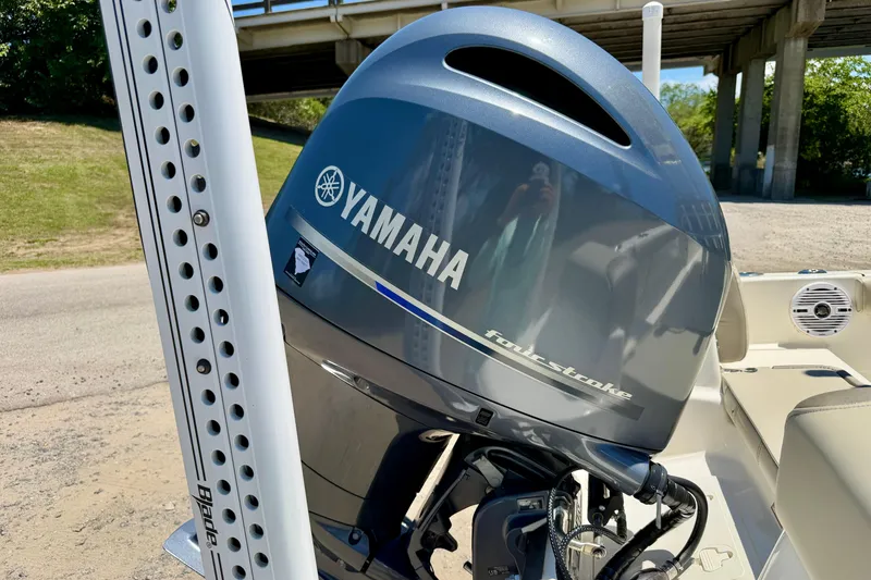 Slide: The Image of 2023 Key West 189 FS boat with Yamaha four-stroke engine, parked under a bridge. - 37
