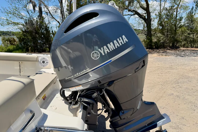 Slide: The Image of 2023 Key West 189 FS boat with Yamaha four-stroke outboard motor in a scenic outdoor setting. - 38
