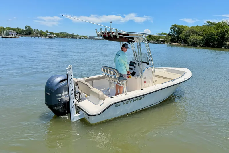 Slide: The Image of 2023 Key West 189 FS boat on calm water, featuring Yamaha outboard motor. - 6