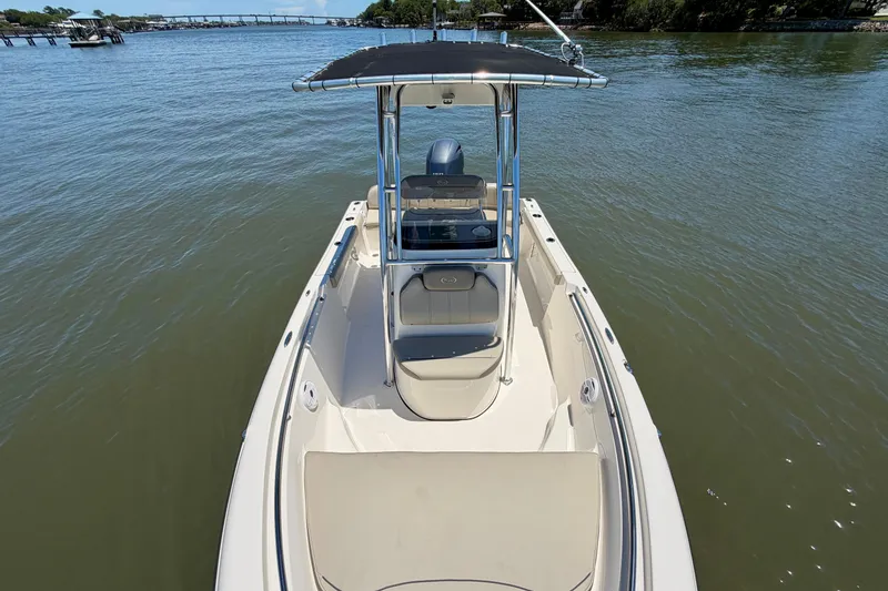Slide: The Image of 2023 Key West 189 FS boat on calm water, featuring a sleek design and spacious deck. - 8