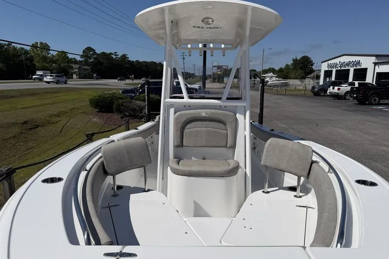 Slide: The Image of 2024 Sea Hunt Ultra 219 boat with spacious seating and modern design. - 6