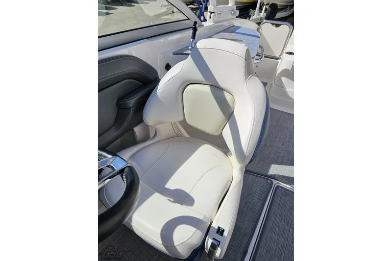 Slide: The Image of Captain's seat of 2016 Chaparral 244 Sunesta boat, featuring white upholstery and sleek design. - 107