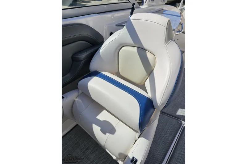 Slide: The Image of 2016 Chaparral 244 Sunesta boat seat with white and blue upholstery. - 108
